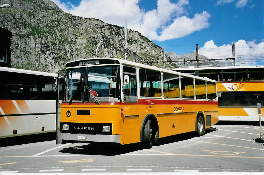 (048'713) - Mattli, Wassen - UR 9104 - Saurer/Tscher am 23. Juli 2001 beim Bahnhof Andermatt