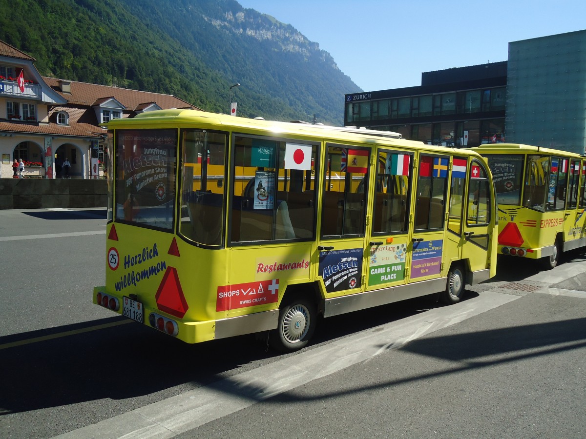 (134'672) - JungfrauPark, Matten - BE 681'188 - CMEC Personenanhnger am 3. Juli 2011 beim Bahnhof Interlaken Ost