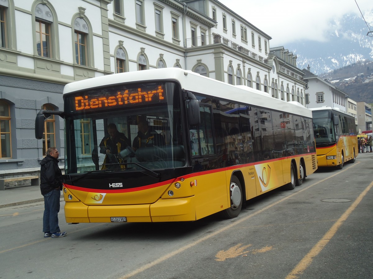 (137'790) - PostAuto Wallis - VS 241'983 - Scania/Hess am 19. Februar 2012 beim Bahnhof Brig