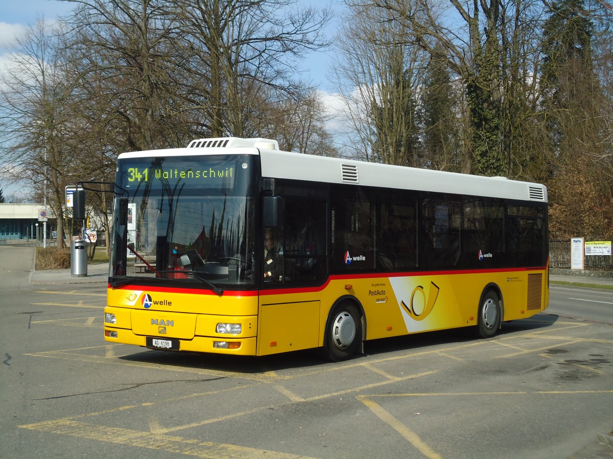 (138'062) - Geissmann, Hgglingen - AG 6198 - MAN am 6. Mrz 2012 beim Bahnhof Wohlen