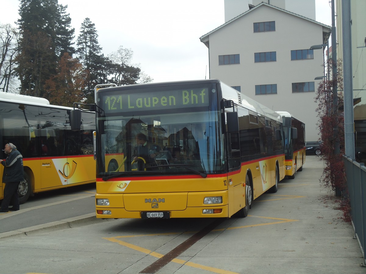 (148'165) - Klopfstein, Laupen - Nr. 12/BE 669'359 - MAN (ex STB Laupen Nr. 23) am 25. November 2013 beim Bahnhof Ddingen