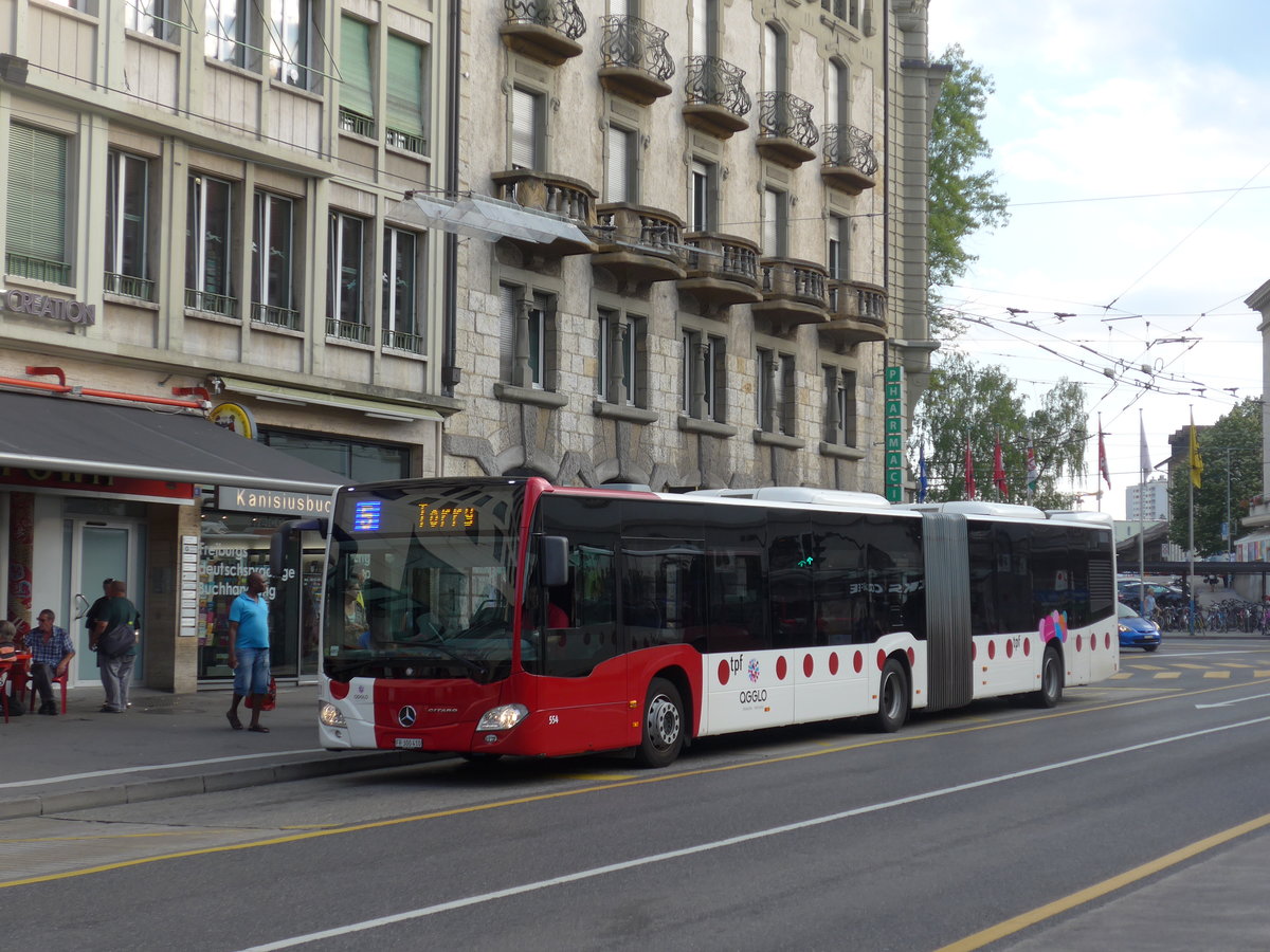 (195'350) - TPF Fribourg - Nr. 554/FR 300'410 - Mercedes am 31. Juli 2018 beim Bahnhof Fribourg