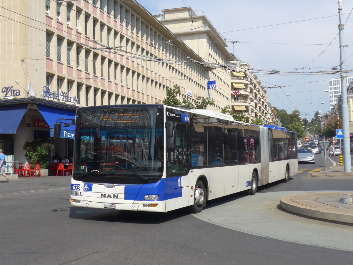 (195'779) - TL Lausanne - Nr. 673/VD 159'405 - MAN am 6. August 2018 beim Bahnhof Lausanne