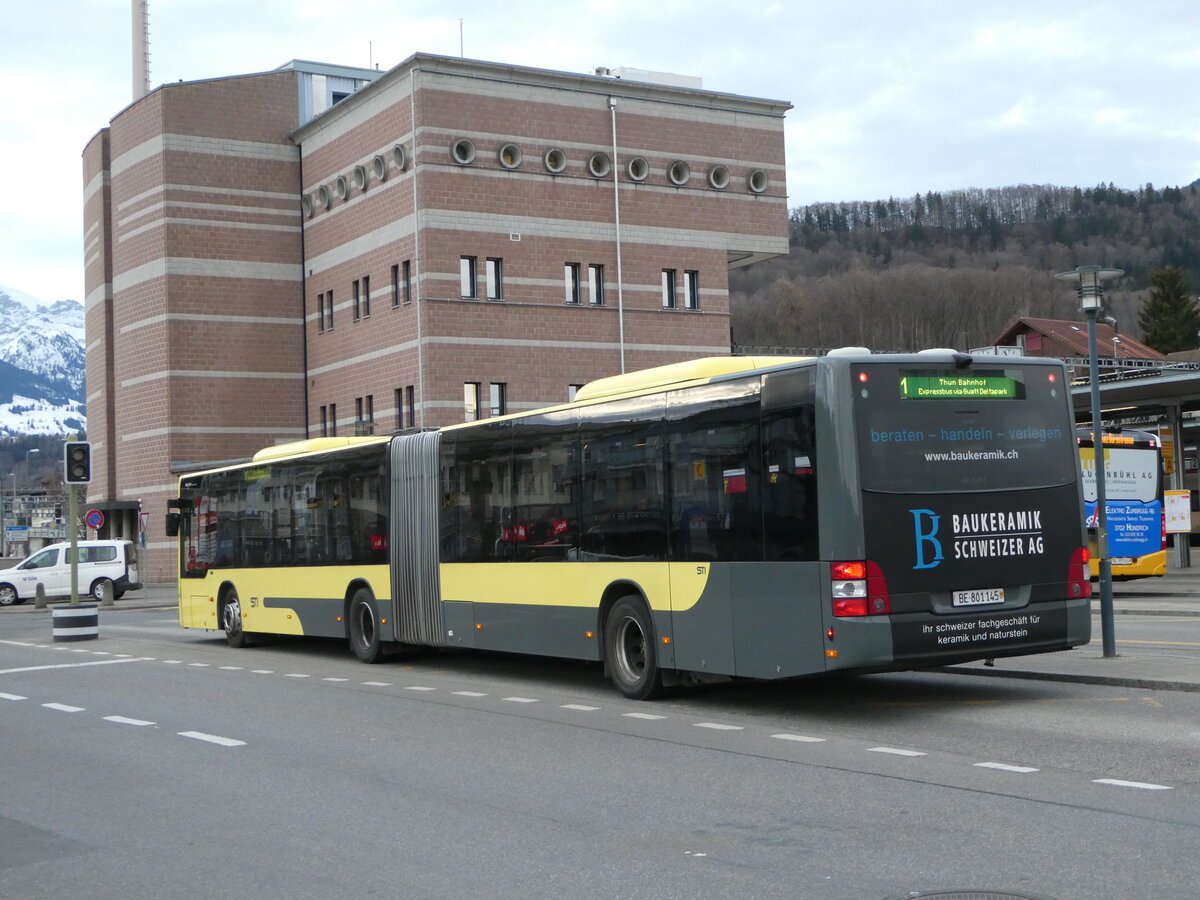 (246'195) - STI Thun - Nr. 145/BE 801'145 - MAN am 17. Februar 2023 beim Bahnhof Spiez