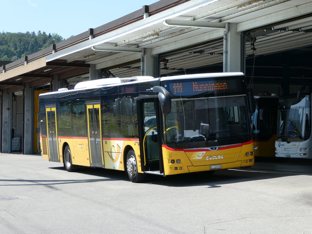 (252'408) - PostAuto Nordschweiz - BL 140'639/PID 10'966 - MAN am 7. Juli 2023 in Laufen, Garage