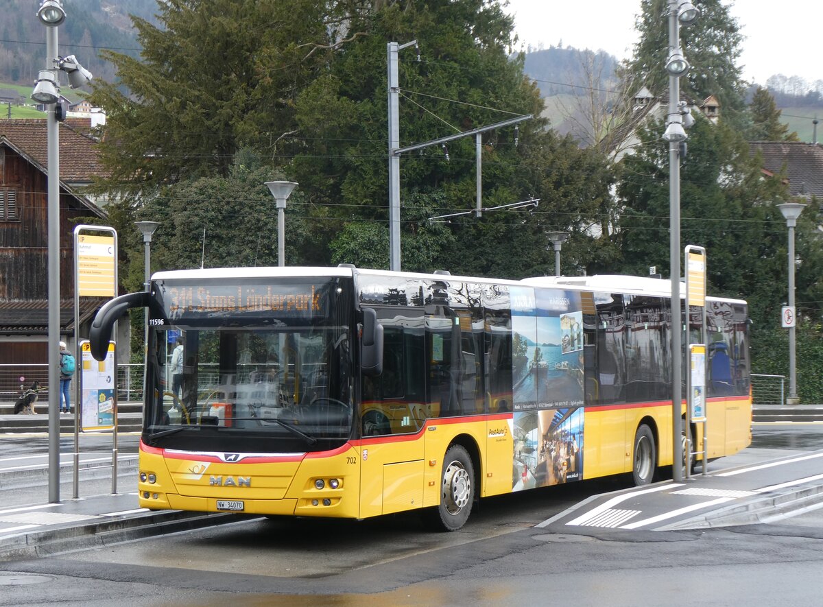 (260'305) - PostAuto Zentralschweiz - Nr. 702/NW 34'070/PID 11'596 - MAN (ex Nr. 72) am 12. Mrz 2024 beim Bahnhof Stans