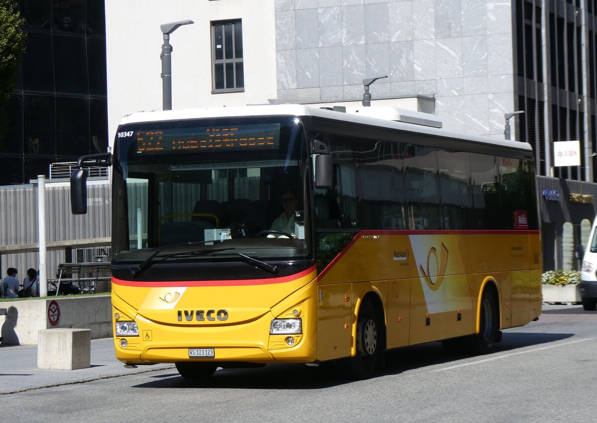 (265'213) - BUS-trans, Visp - VS 123'123/PID 10'347 - Iveco am 28. Juli 2024 beim Bahnhof Visp