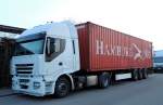 Ein Iveco Stralis mit einem 40 ft Container in Illertissen am 21.03.2013.